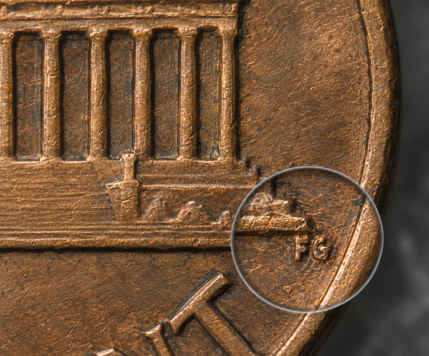 FG initials on the reverse of a 1999 Wide AM penny