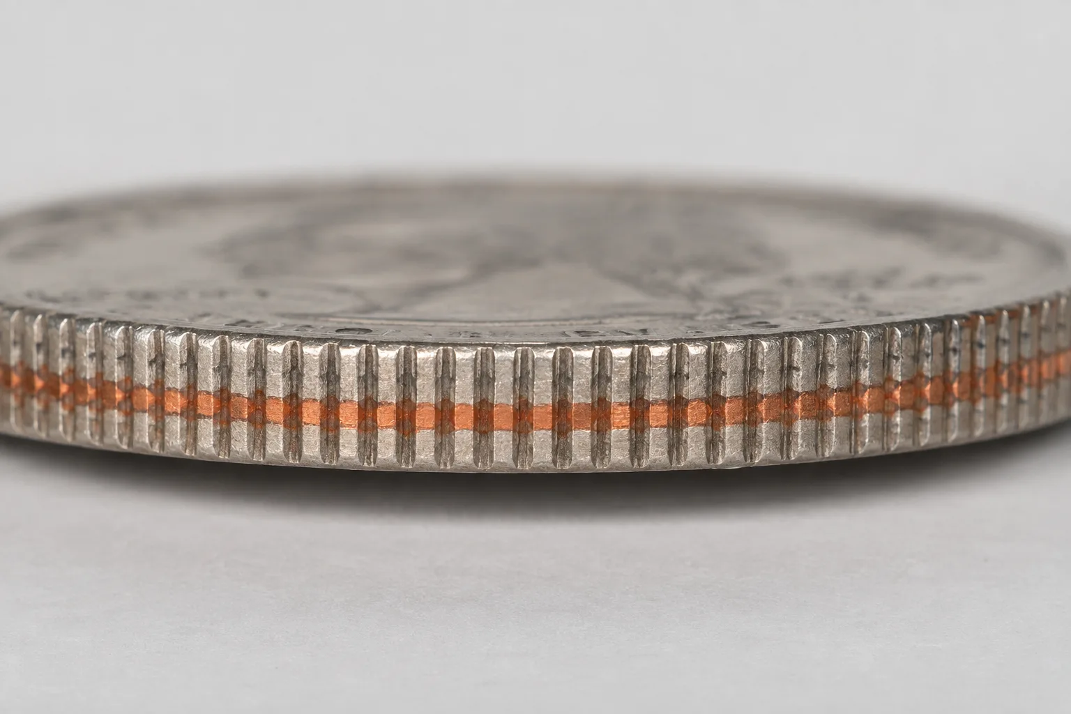 Educational macro of a copper nickel clad quarter edge